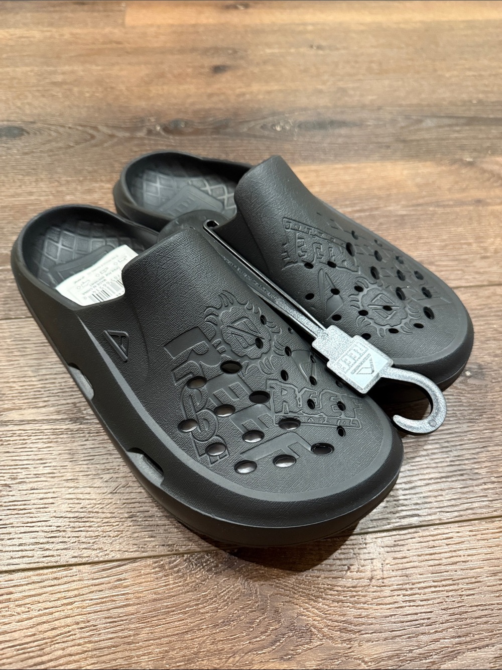 Brand New Mens Reef Gliders, Size 11
Black Foam Clog Slides with Cutout Pattern